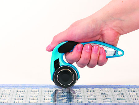 holding rotary cutter with thumb