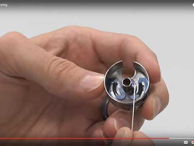 Reinstalling the bobbin case spring